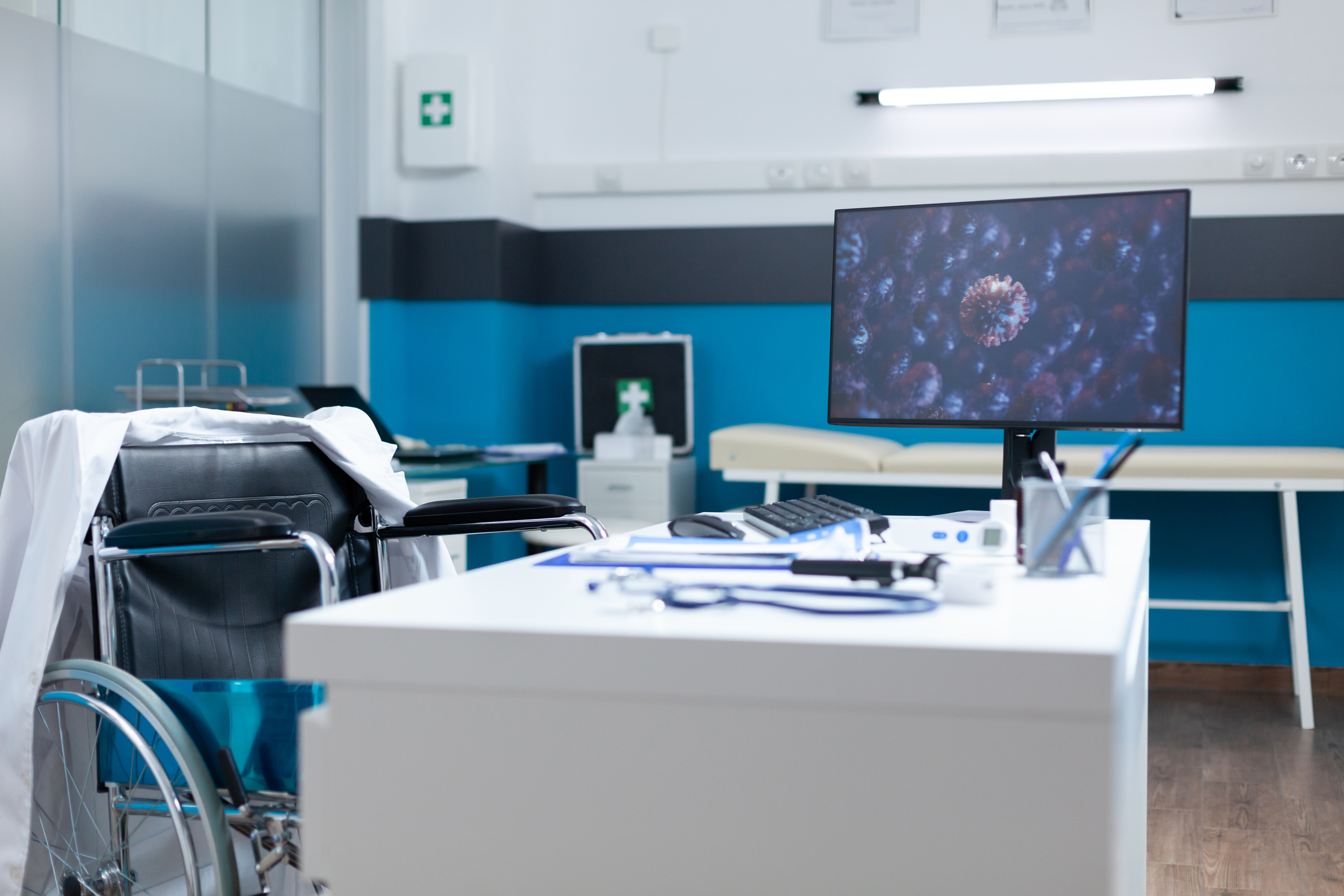 empty examination office with computer standing on desk table