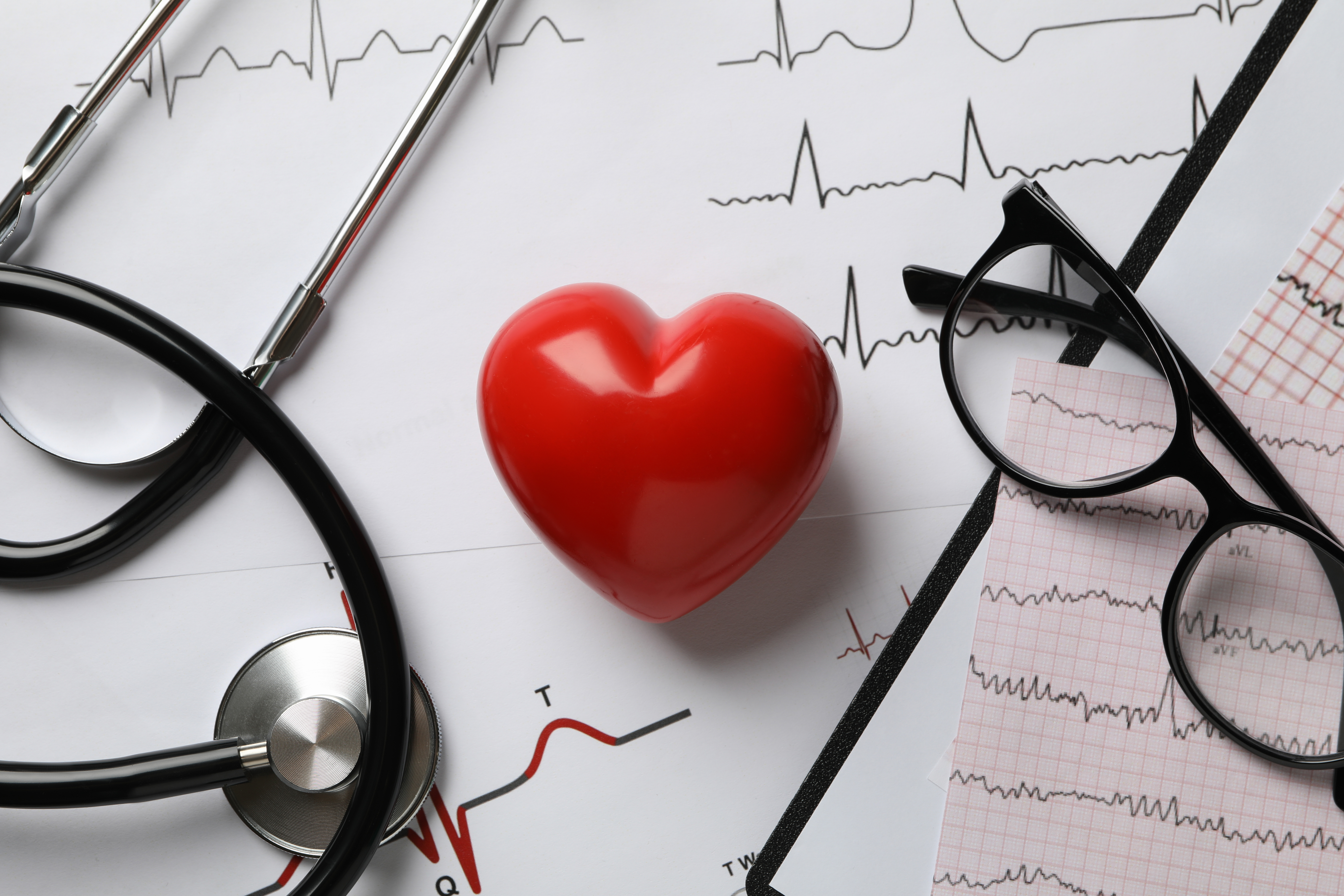 medical concept with heart and electrocardiogram results, close